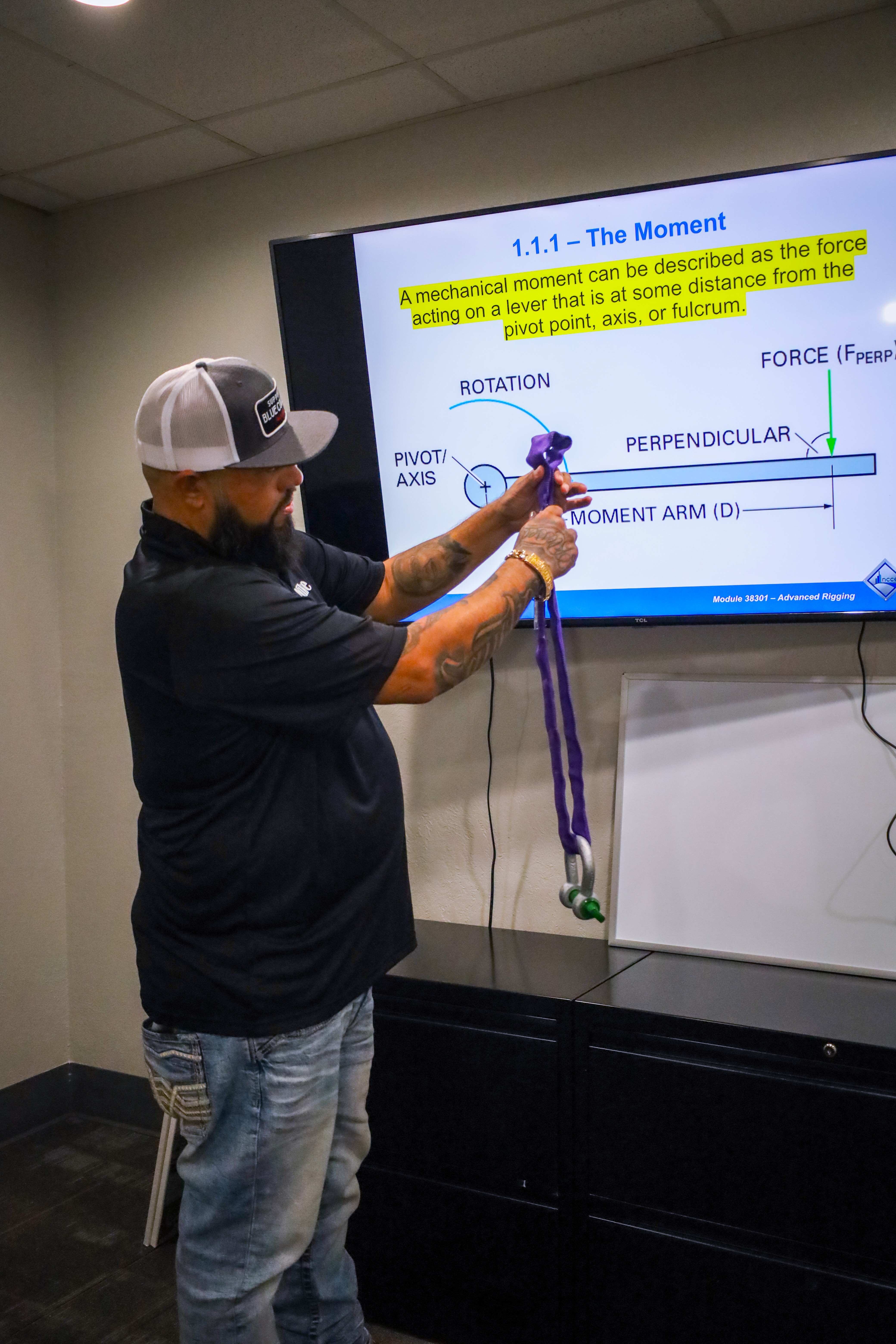 Mike Sanchez teaching students how to inspect a sling during Advanced Rigger training