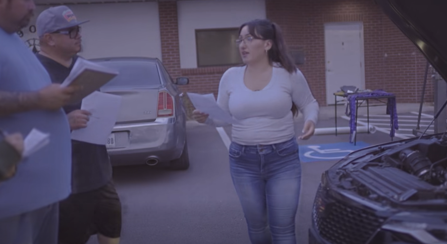 Maria doing a vehicle inspection with a class